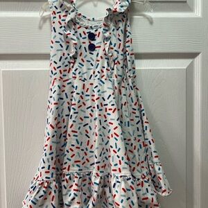 White sleeveless dress with blue and red “sprinkles” size 5-6 pre-owned